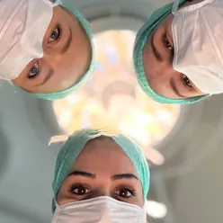 A group of surgeons wearing masks